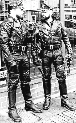 Black and white photographs of two men covered in black leather staring each other down