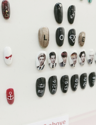 Nail art by Enchanted Siblings with printed Korean idols