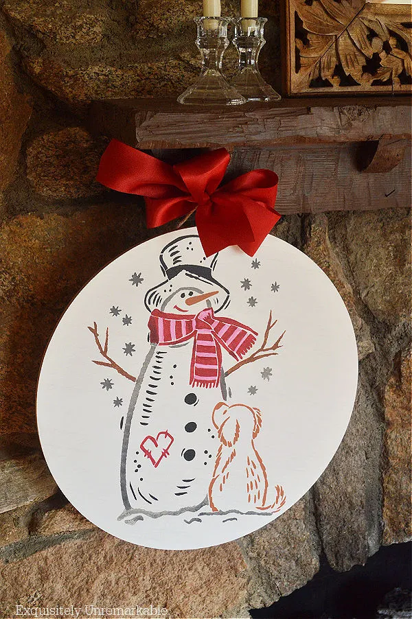 Snowman Puppy Winter Stencil Round hanging on the fireplace