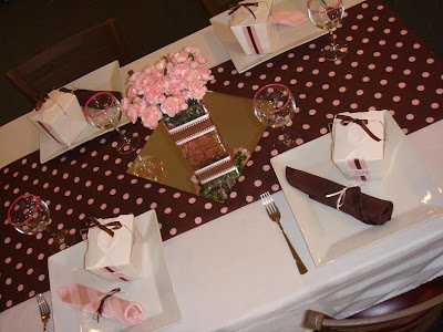 Each table had handmade table runners pink and brown in Damask and 