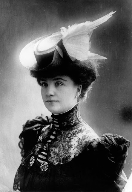 Kristin Holt | Madam, is that a duck on your hat? Vintage photograph, Victorian, showing a white feathered wint decorating a young woman's hat.