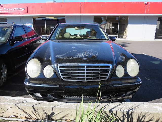 Hood looks horrible due to sun damage and peeling--before repairs at Almost Everything Auto Body