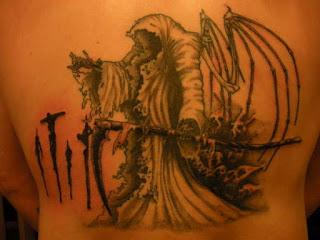 Death tattoo on the back: Grim Reaper with skeletal wings