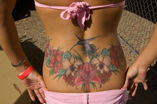 large lower back tattoos for women. Lower back tattoos for women