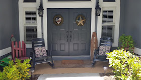 Front porch with newly painted rocking chairs