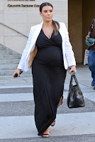 Kim Kardashian pregnant in a glamorous black dress