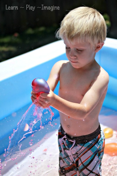 Popping balloons filled with colored water