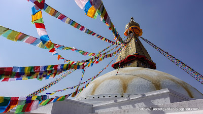 Kathmandu Boudhanath Stupa and prayer flag under blue sky