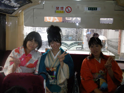 Girls wearing yukata on a bus, Osaka