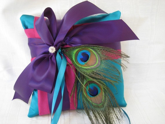 this peacock blue ring bearer pillow with teal fuchsia and purple satin
