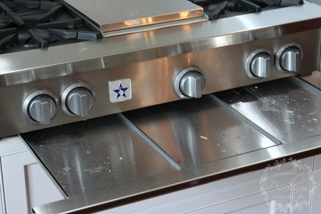 cleaning the gas range top drip pans