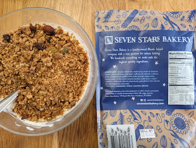 Seven Stars Bakery granola, in a bowl of yogurt with bag off to the side