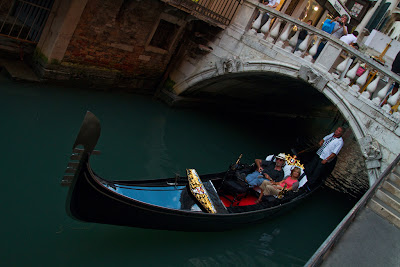 Tourists on one of the Venetian Canals - Venice, Italy