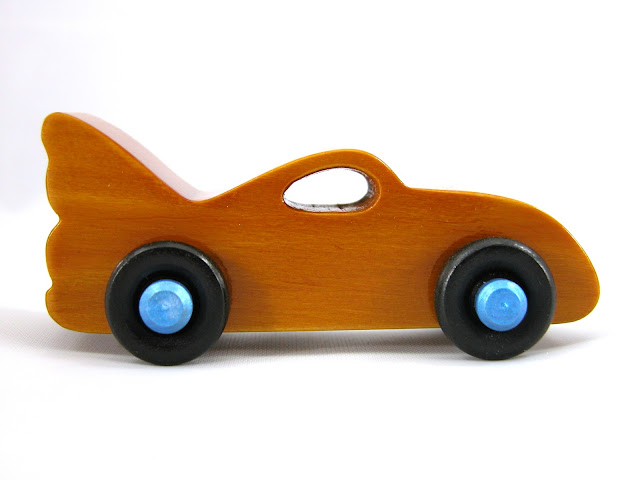 Handmade Wood Toy Car based on the Bat Car in the Play Pal Series, Amber Body, Metallic Blue Hubs, Black Wheels