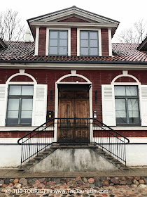 Kipsala - red wooden house. Facade Riga. Latvia.