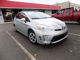 2012 Prius with delaminating or peeling paint on the front bumper before repair at Almost Everything Auto Body.