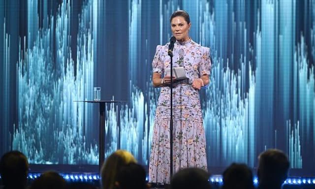 Crown Princess Victoria wore a new Aimee short sleeves and high neck blue floral summer dress from By Malina