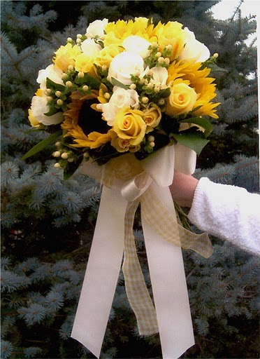 Medium yellow and white roses intermixed with stunning sunflowers