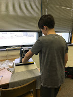 student using our heat press to press their design on their tshirt