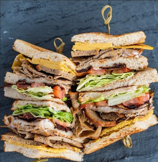 A photo of vegan club sandwich