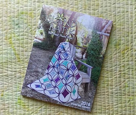 Moonrise quilt on the cover of the spring 2018 Island Batik catalog