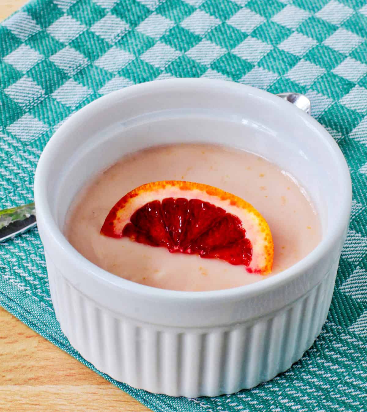 Blood Orange Posset with an orange slice on top.