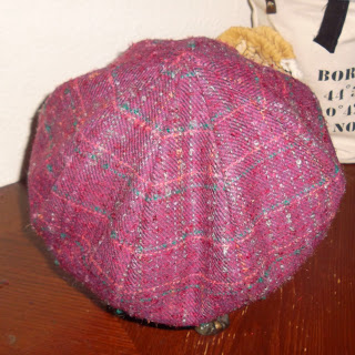 Eight-paneled crown for 'newsboy' style hat in reddish-purple plaid