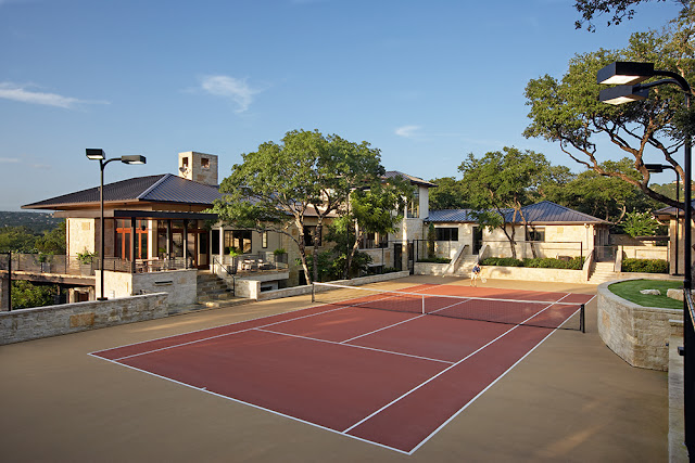 Picture of tennis court in the upper level of property