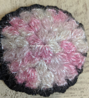 Sweet Nothings Crochet pattern blog, crochet pattern for a floral hair bun net, photo of the floral hair bun net,