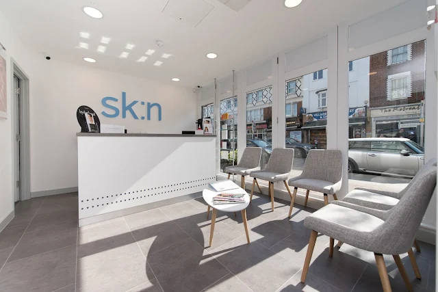 A light and airy waiting room in shades of white and grey