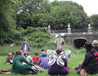 An outdoor, strolling performance of Down the Rabbit Hole
