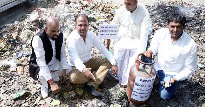 sumit-gaur-did-a-unique-protest- by-sitting-on-a-pile-of-garbage