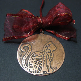 Salt water etched copper cat Victorian style Christmas tree decoration.  Etched using vinyl resists cut by Silhouette Cameo.  Tutorial by Nadine Muir for Silhouette UK Blog