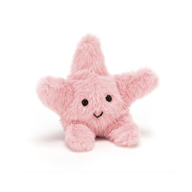A pink fluffy starfish plushie.