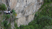 To the north, the inca drawbridge connects a path that hugs a cliff, . (inca drawbridge machu picchu)