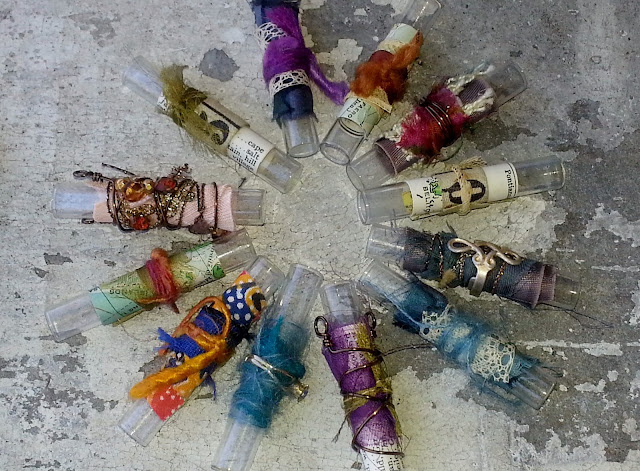 more fiber arts collage on recycled glass vials