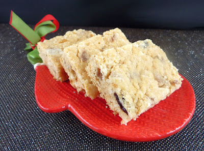 Three Mincemeat Shortbread Bars, photographed on a red and green mitten-shaped plate