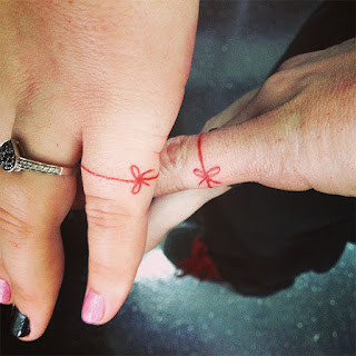 cross ring tattoo