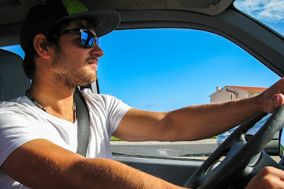 Man with sunglasses while driving