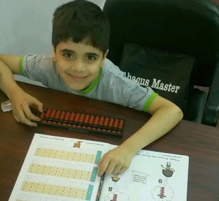 student learning with abacus learning kit