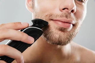 *"Man achieving a precise beard trim at home with a high-quality 2025 trimmer
