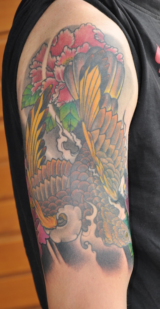  more flowers to his falcon/hawk piece. Here's how it looks 6 months old.