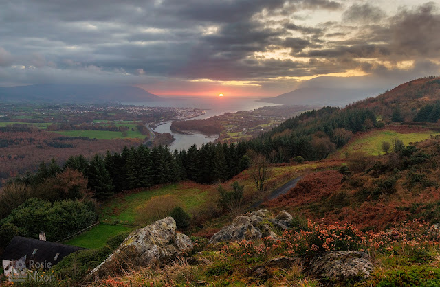 Overlooking Carlingford Lough from Flagstaff Viewpoint with the rising sun in the middle of the Lough