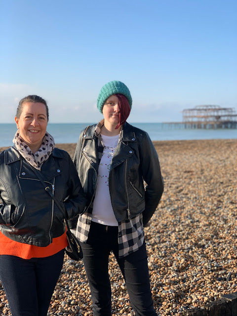 Women standing on Brighton beach