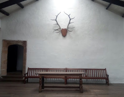 Skipton castle hall with antlers on the wall