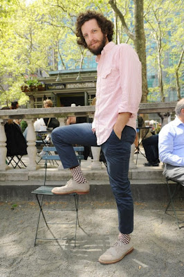 'Socks are like lingerie for men,' according to Josh Bearman, sporting brown and white checks.