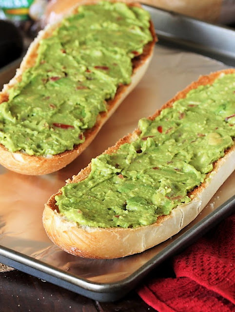 Guacamole Spread on Broiled Buttered French Bread Halves Image