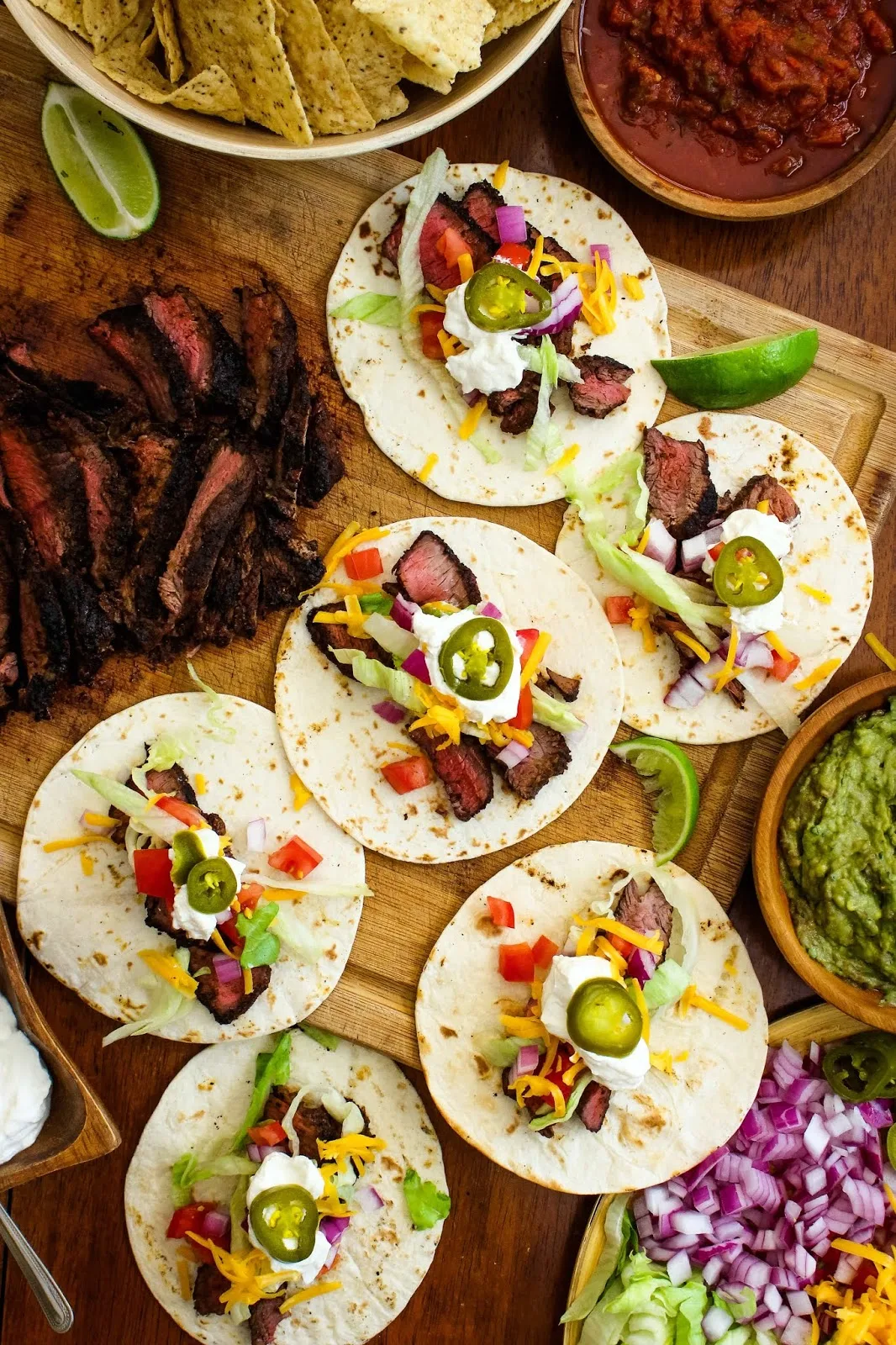 Grilled Sirloin Steak Tacos feature dry-rubbed grilled sirloin steak topped with all of your favorite taco toppings. You will want to make them all summer long! #tacos #steaktacos #grillingrecipe