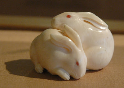 Kaigyokusai {Masatsugu}, Japan 1813-1892, pair of rabbit netsuke in ivory with inlays