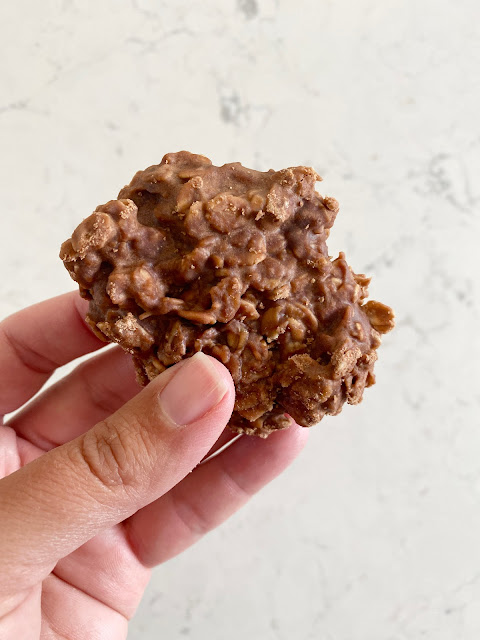 Hand holding a No Bake Cow Pie cookie.